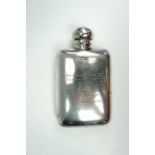 A 1920s silver hip flask bearing an engraved presentation inscription "Waterloo Cup, 1936, Centurion