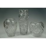 Three large cut glass vases, tallest 36 cm