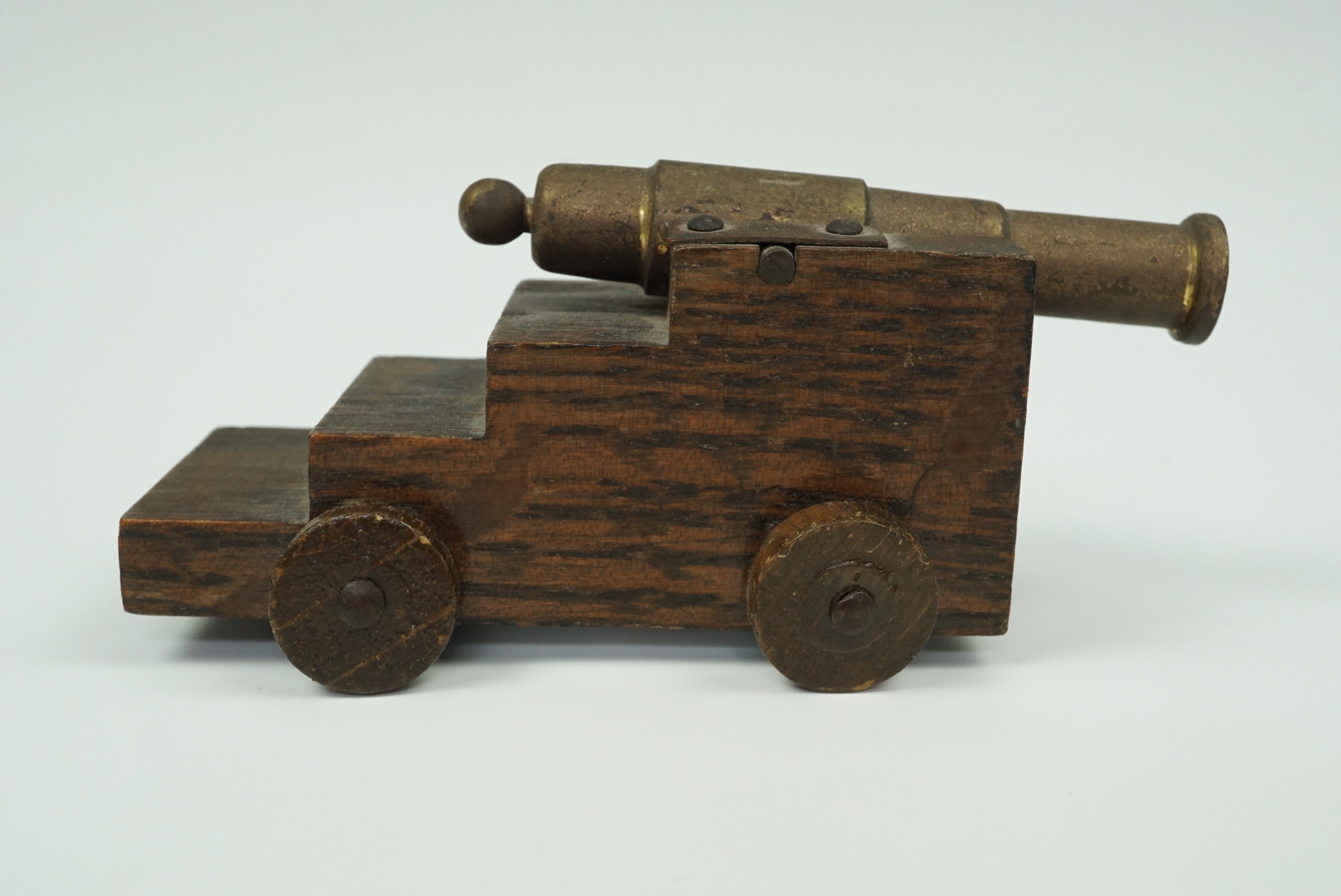 A small model naval canon, its truck bearing a copper plaque with the legend "HMS Victory, 1765" and - Image 2 of 2