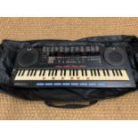 A Yamaha PSS-790 keyboard with AWM voice and rhythm in a travel bag