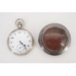 An early 20th Century Cyma nickel-cased pocket watch and tinplate watch protector, (running)