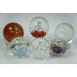 Six controlled bubble paperweights