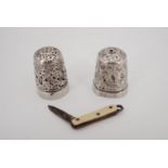 A silver thimble, one other thimble and a miniature fob pen knife