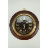 A Greenoble London brass wall clock, diameter 17 cm