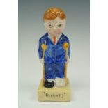 A Great War porcelain figurine of a boy dressed in British army hospital "blues" and entitled "