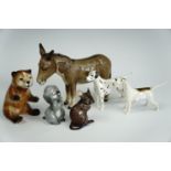 Five Beswick animals comprising a donkey, mouse, three dogs, together with a ceramic bear