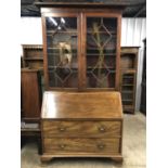 A George IV / William IV mahogany bureau bookcase, 121 cm x 54 cm x 229 cm