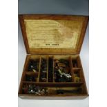 A large 1940s Paragon first aid box containing a quantity of plastic toy soldiers etc