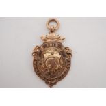 A 1913 Fylde County Cricket winner's 9 ct gold prize fob medallion, 31 mm excluding suspender, 4.7
