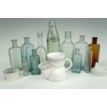 Sundry antique glass bottles, a pot lid, shaving mug and small pressed glass hen-on-nest