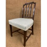 A George III upholstered mahogany dining chair, the Hepplewhite influenced back having three