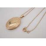 A 9 ct gold pendant double locket, on a fine-link neck chain, 26 mm x 20 mm, 4.8 g