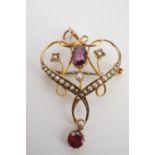 A Belle Epoque almandine, graded seed pearl and yellow metal openwork pendant / brooch, stamped 9 ct