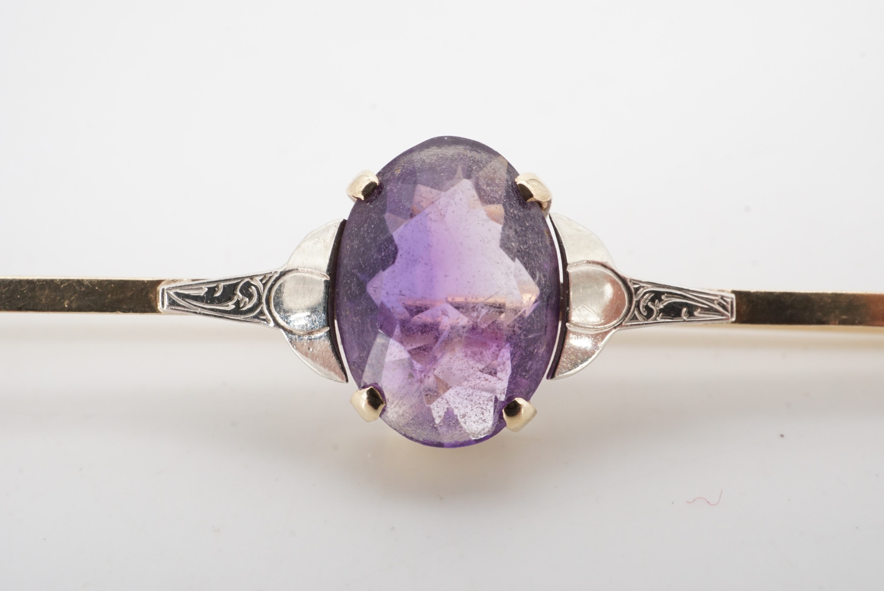 An amethyst and 9 ct gold bar brooch, circa 1930s, stone 11 mm x 8 mm, 6 cm, 3.8 g - Image 2 of 3