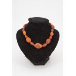 A vintage amber nodule necklace, of graded irregular beads, circa 1930s, largest approximately 30 mm