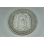 A relief plaster plaque portraying J S Bach, 42 cm