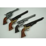 Four inert replica Colt pistols
