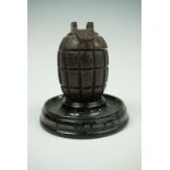 A Great War memento ink well or match pot fabricated from a Mills grenade casting