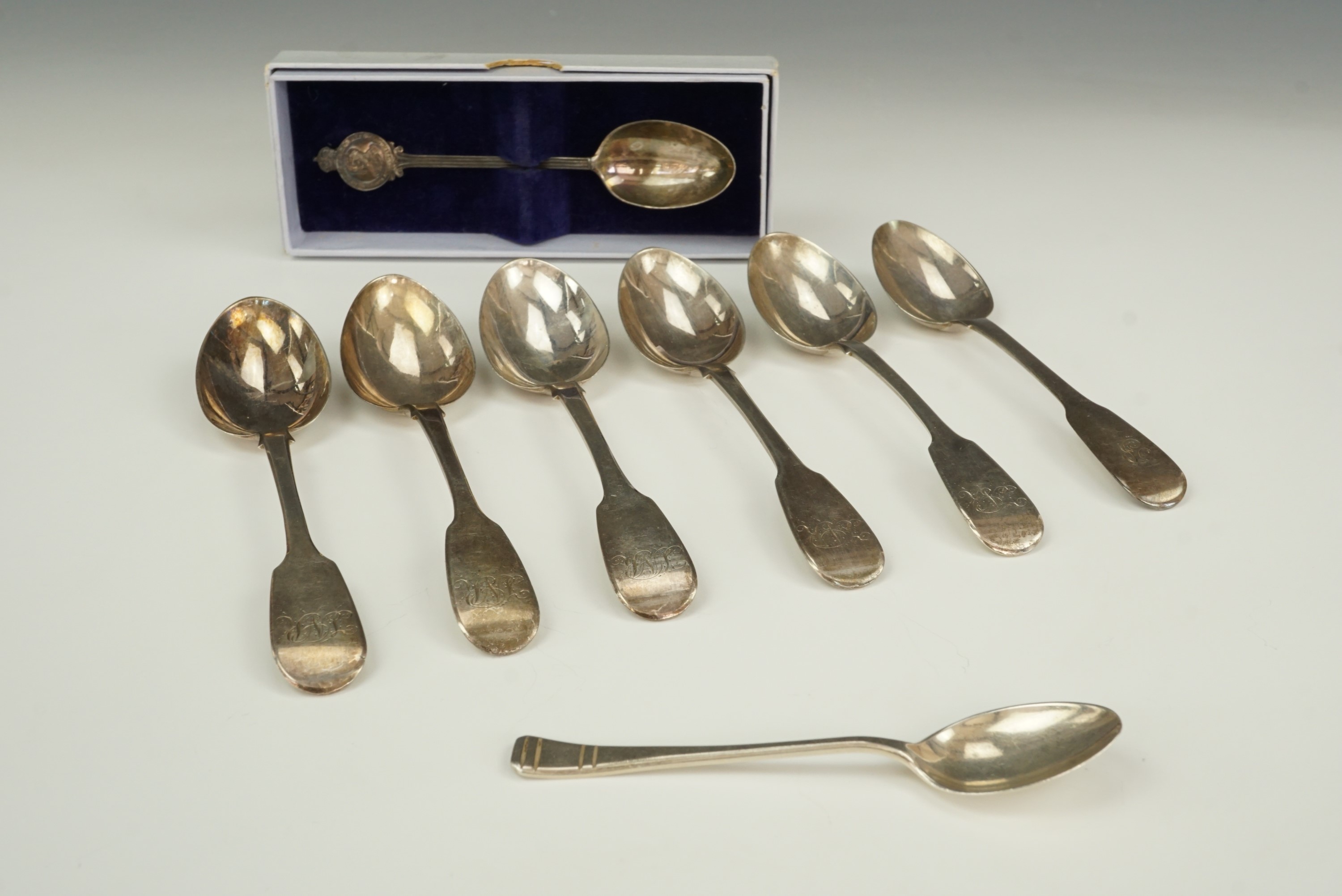 A 1925 Silver Jubilee commemorative tea spoon together with five Georgian silver fiddle pattern