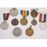 A collection of Great War Armistice, peace and victory commemorative medallions