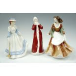 Three Royal Doulton figurines; 'Summertime', 'Autumntime' and 'Wintertime', tallest 23 cm