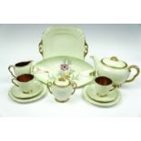 A Carlton Ware cabaret gilt tea set (1630) together with a Carlton Ware dish