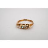 A 1930s emerald and diamond ring, comprising a central 2 mm emerald claw set between pairs of