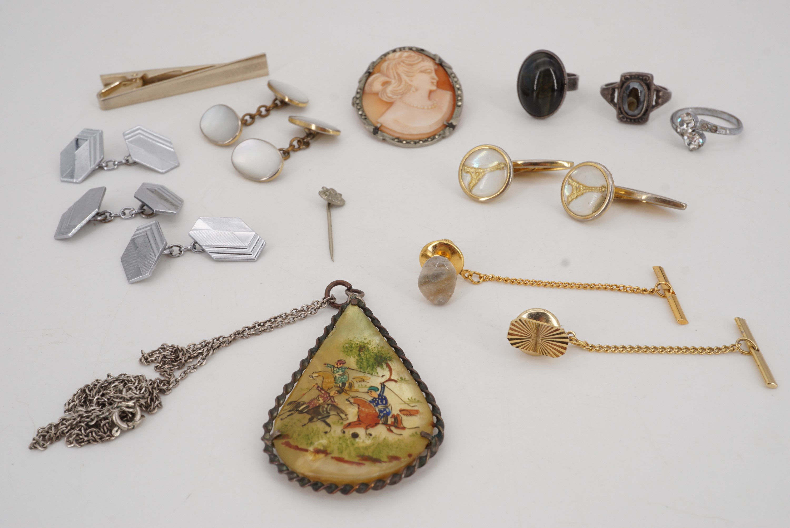 A small group of vintage costume jewellery including Art Deco and Eiffel Tower cuff links