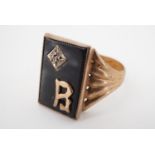 An early 1970s 9 ct gold and black onyx signet ring, W, 5.3 g