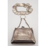 A silver coin and charm bracelet, circa 1930s, together with an electroplate ring purse