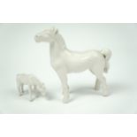Two small Chinese blanc de Chinese porcelain horses, largest 7.5 cm