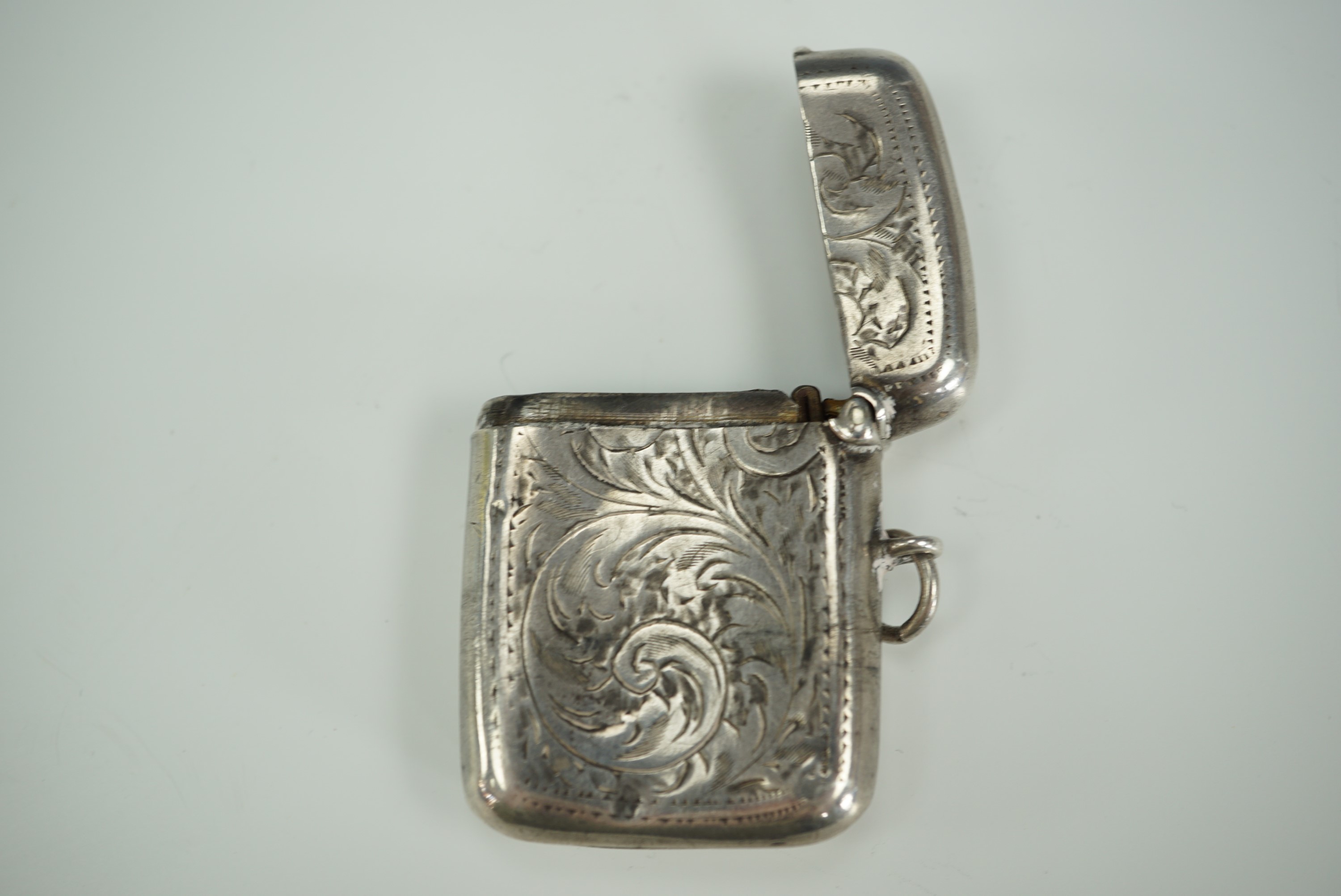 A George V silver Vesta case, contoured cushion shaped and foliate scroll engraved - Image 4 of 4