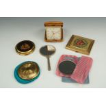 Vintage Gwenda and other powder compacts together with a travel clock, purse mirror and 1960s