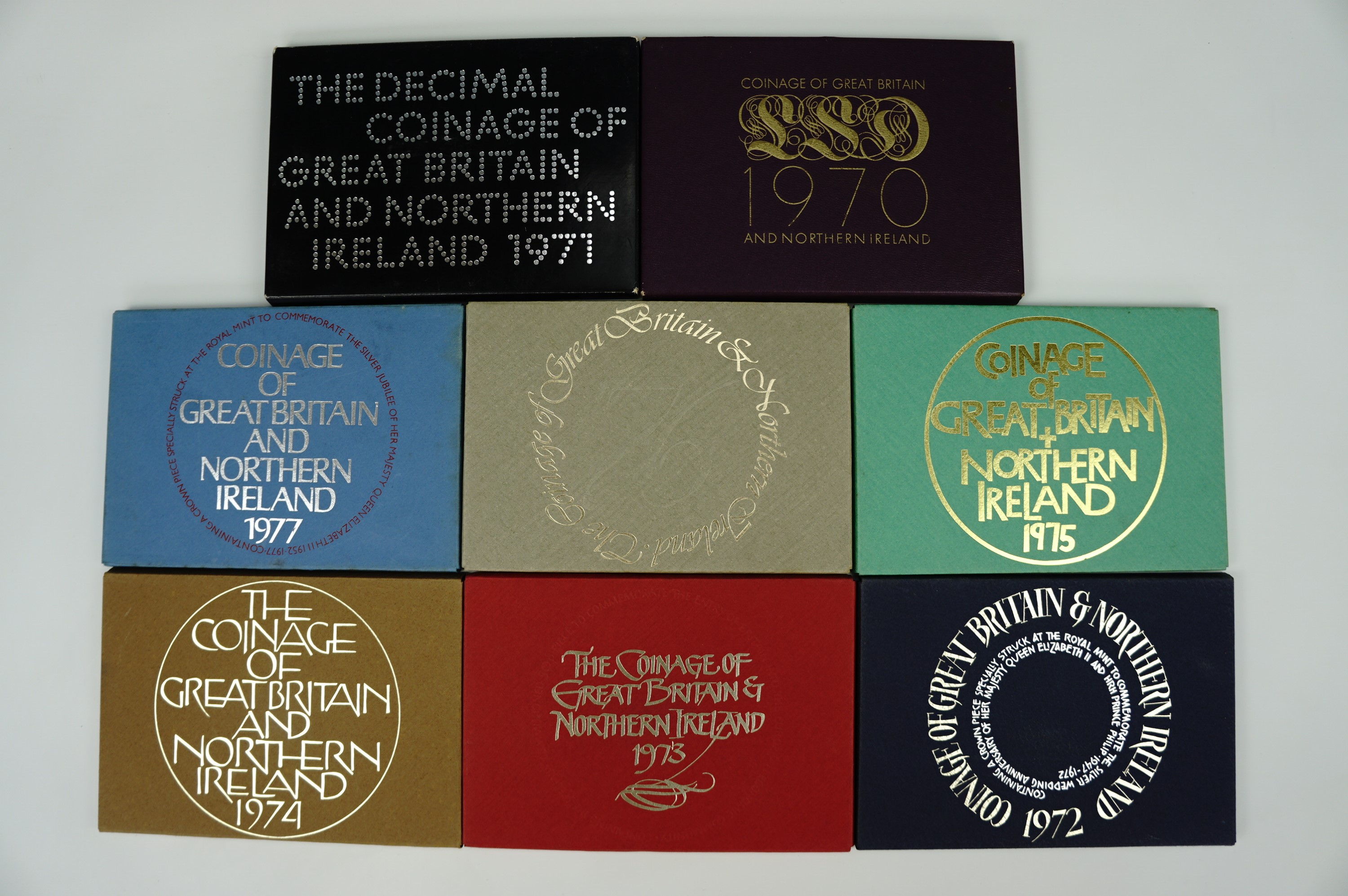 A quantity of cased 'Coinage of Britain and Northern Ireland' cased coin year sets