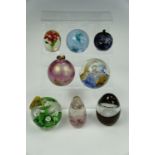Eight paperweights including Caithness, Millracle glass etc