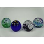 Four Caithness paperweights