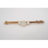 An opal, pearl and 9 ct gold bar brooch, comprising a central spherical opal of approximately 6 mm