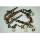 A collection of inert replica antique pistols