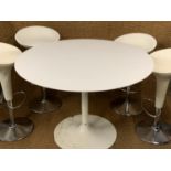 Four Stefano Giovannoni Magis Bombo bar stools (labelled), together with a circular table, [the