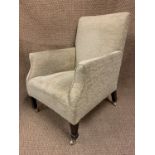 A late 19th / early 20th Century upholstered lounge armchair, having mahogany spade legs with