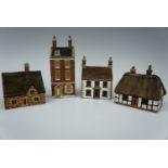 Four Denby stoneware cottages, tallest 16 cm