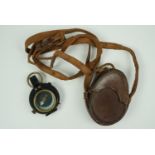 A Great War 1916 dated British Army prismatic marching compass and pouch