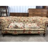 A late Victorian deep-button-upholstered two-seater Chesterfield sofa, 175 cm x 74 cm, seat 120 cm