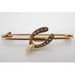 A late 19th / early 20th Century yellow metal wishbone brooch set with split seed pearls, 33 mm, 1.8