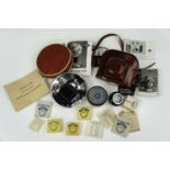 A vintage Agfa 'Ambi Silette' camera together with a matching flash and other accessories