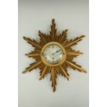 An Elliott Art Deco sunburst wall clock retailed by Johnston & Court of Carlisle, 45 cm