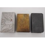 Three Great War trench art matchbox covers including a brass example engraved "Coln A/Rh, 1919"
