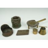 A group of trench art including a trivet, cap etc
