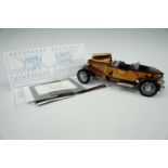 A detailed scale model 1921 Rolls-Royce silver ghost, with documents, 21 cm long