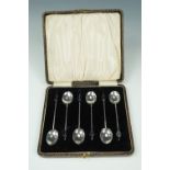A cased set of 1920s silver coffee spoons